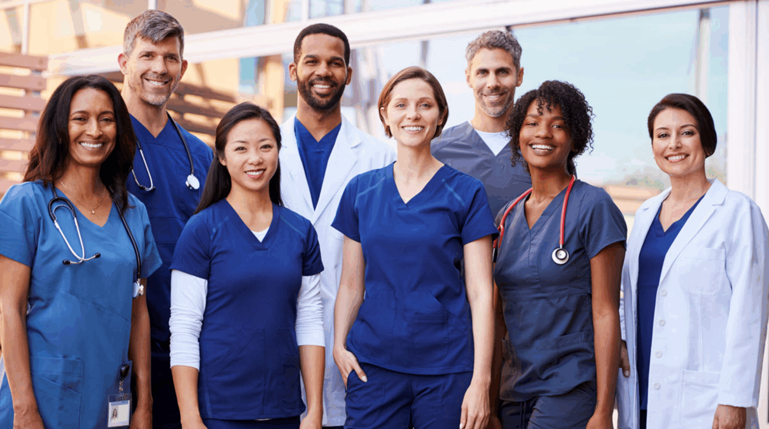 Team of professional caregivers and medical staff smiling at the camera, representing trusted home care in San Francisco